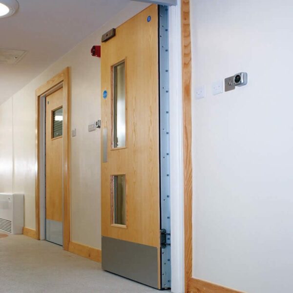 wood doors with continuous hinges and metal kick plates for durability wood doors with continuous hinges and metal kick plates for durability